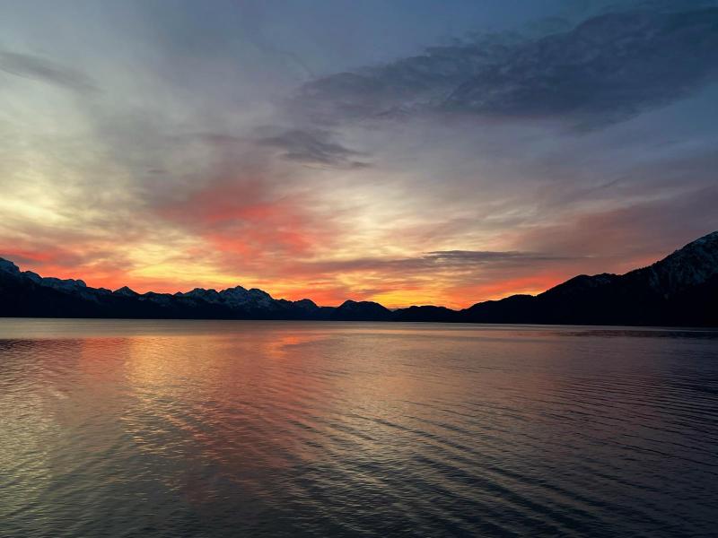 a sunset over a body of water
