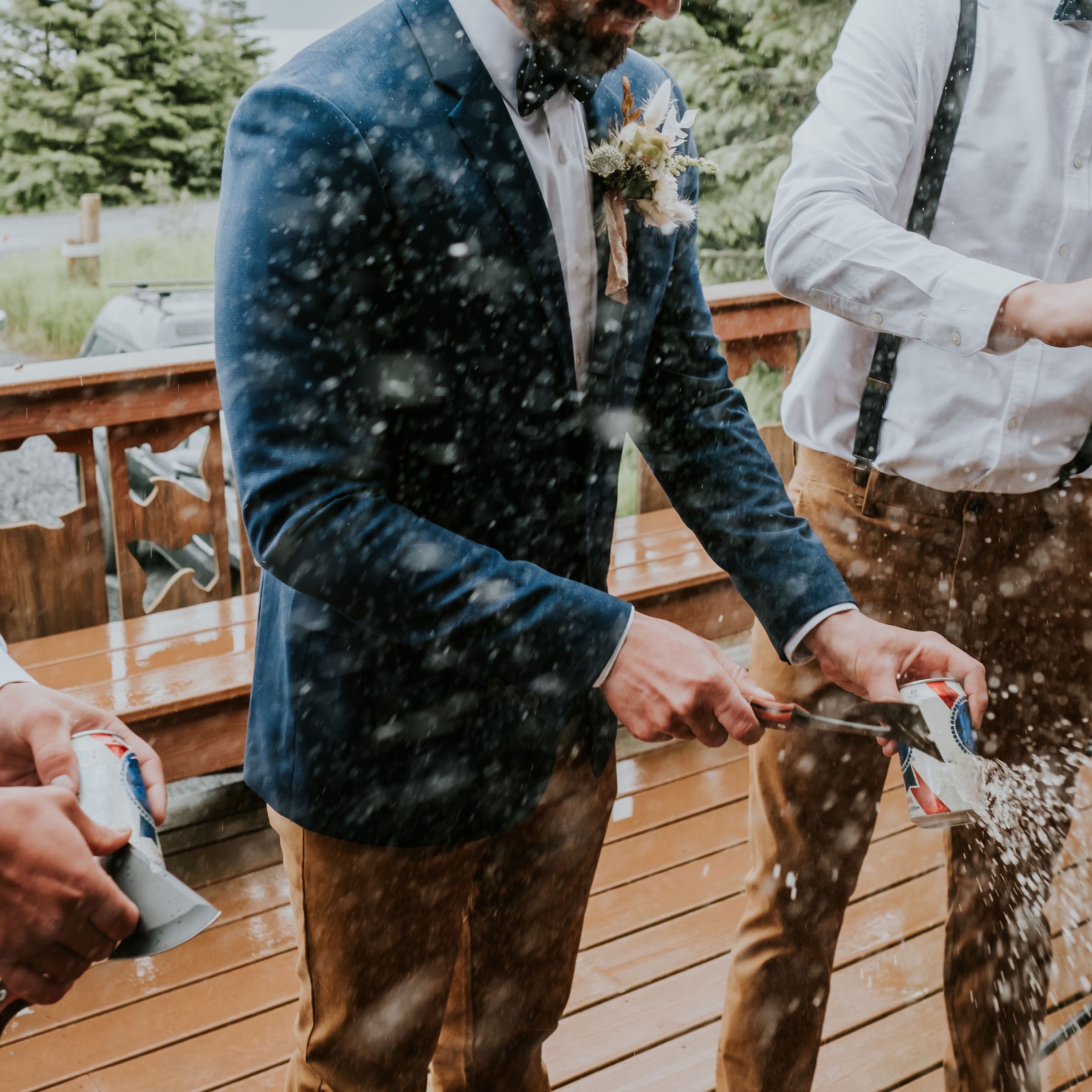 a couple of men standing next to a fence