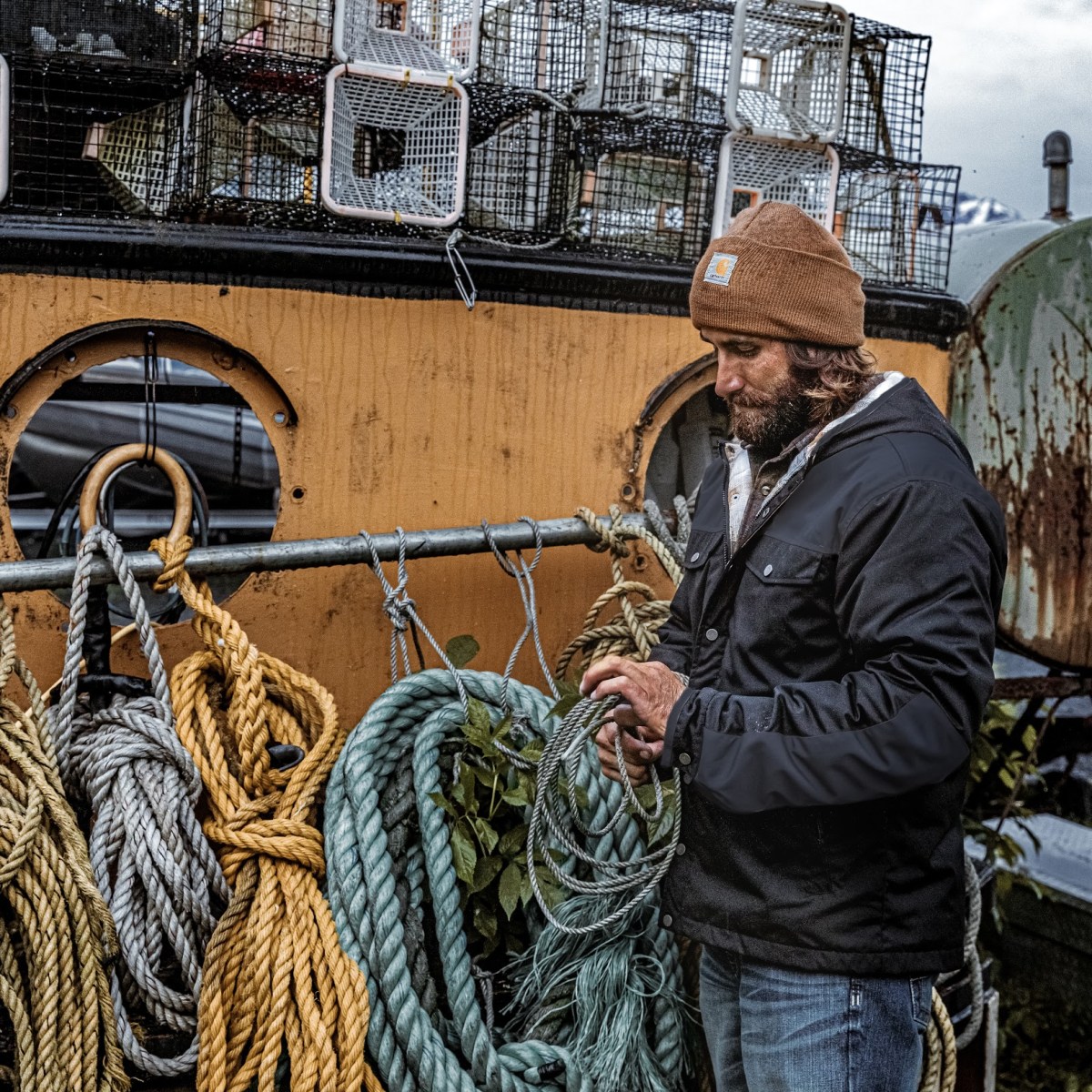 a man and a woman standing in front of a bicycle