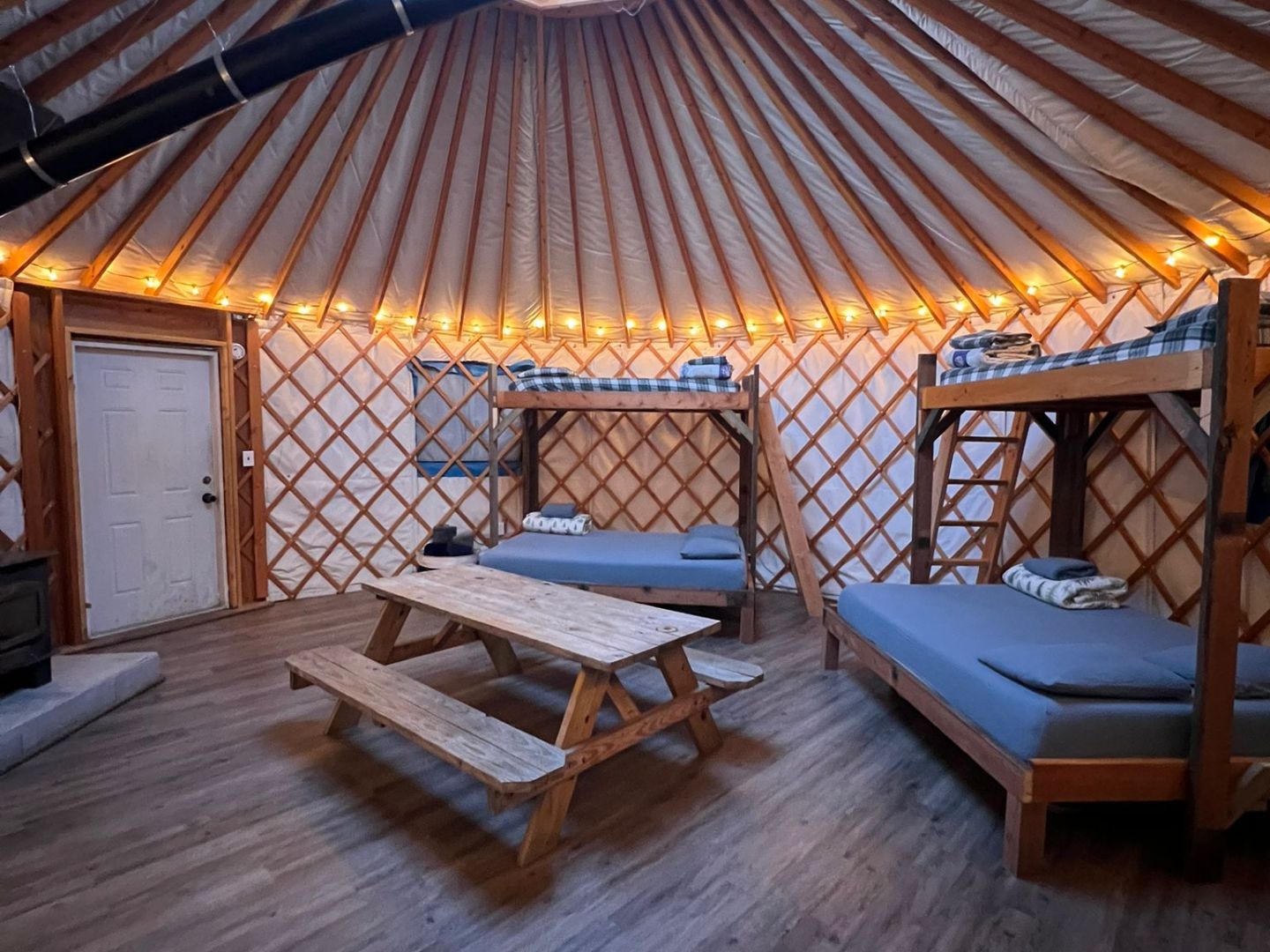 a wooden bench sitting in the middle of a room