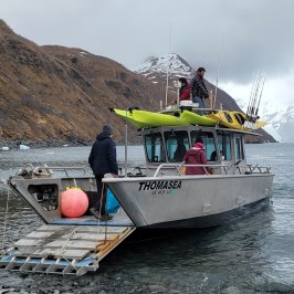a boat sitting on top of a mountain