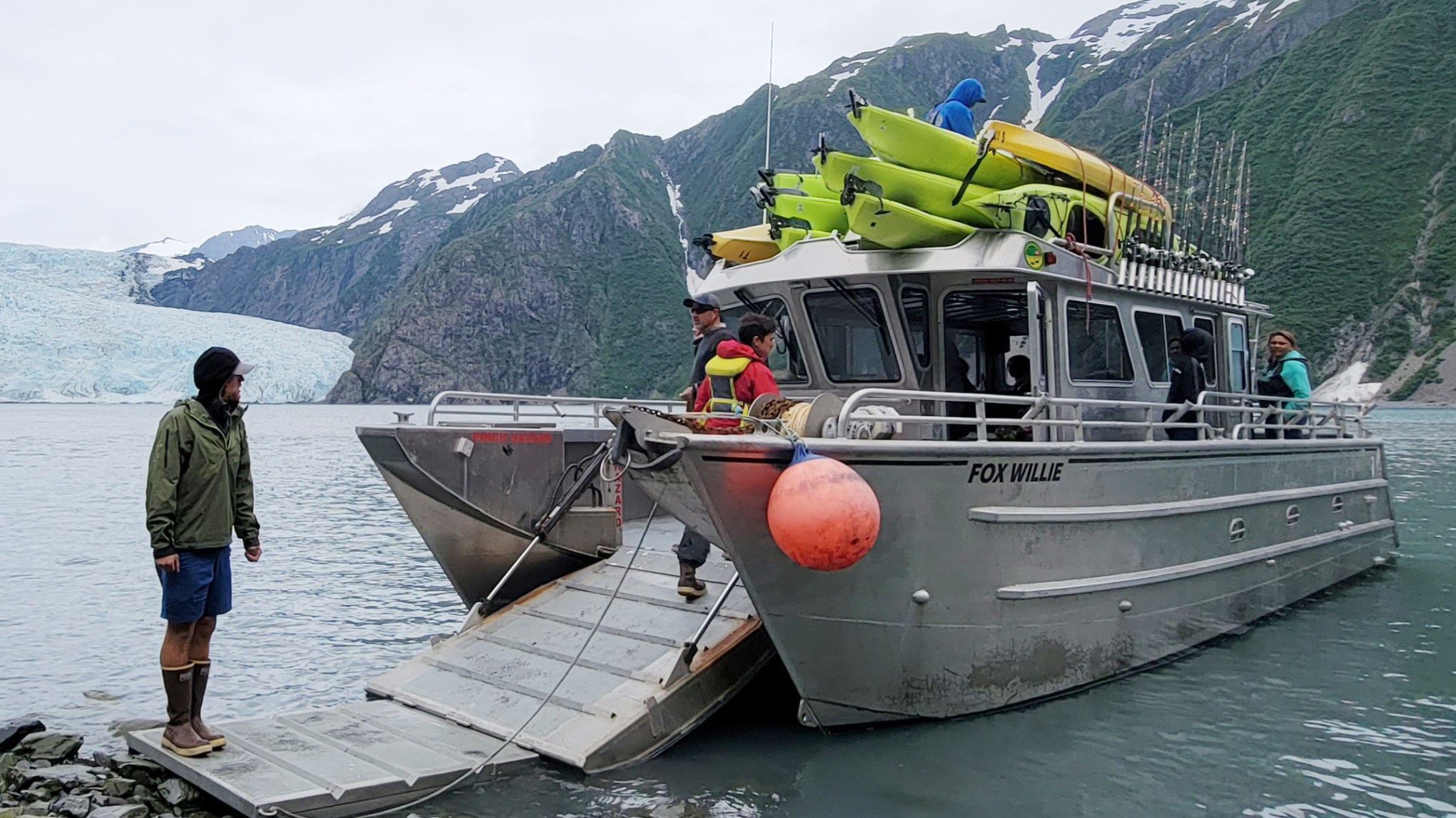 a group of people on a boat in the water
