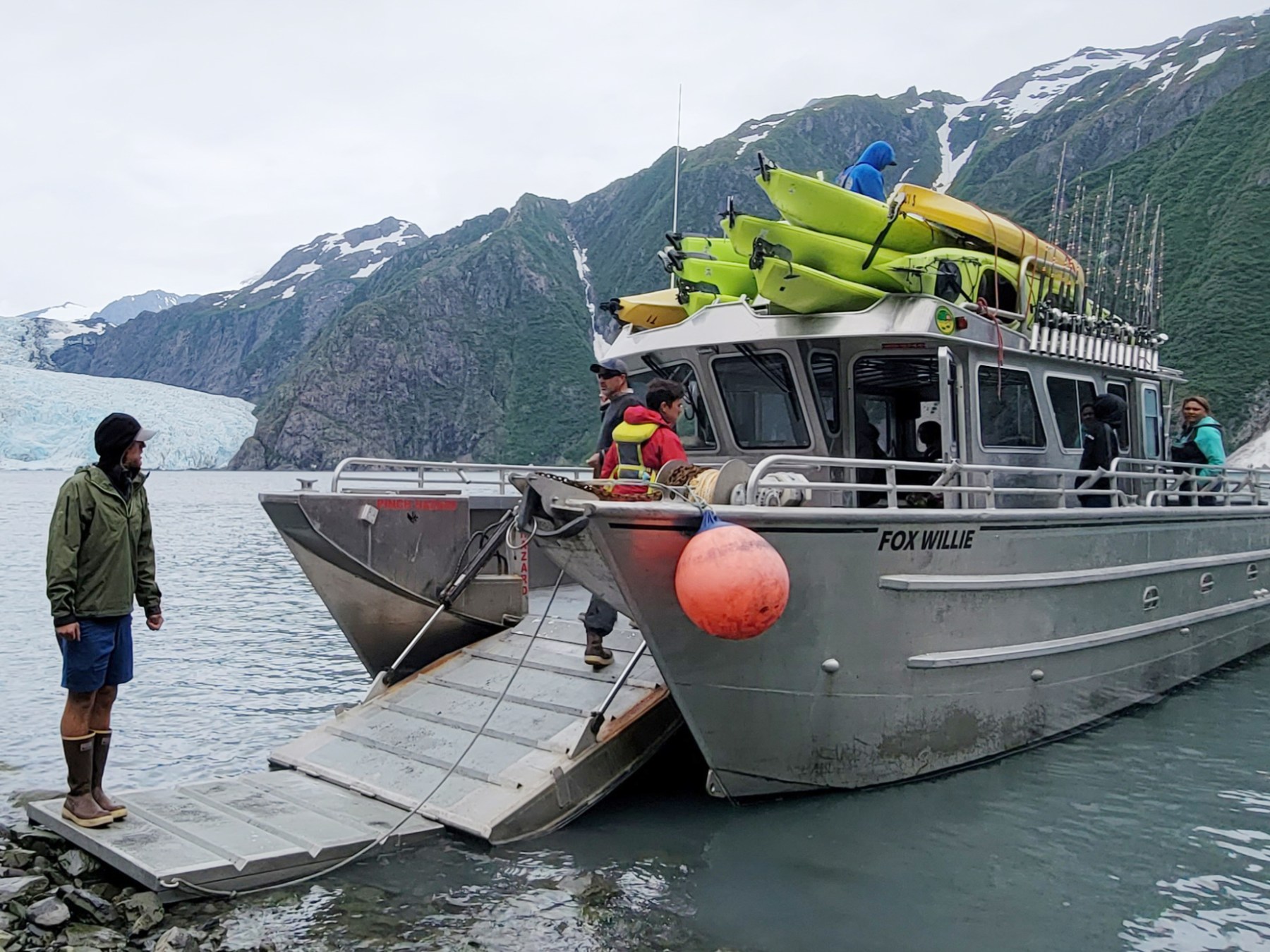 a group of people on a boat in the water