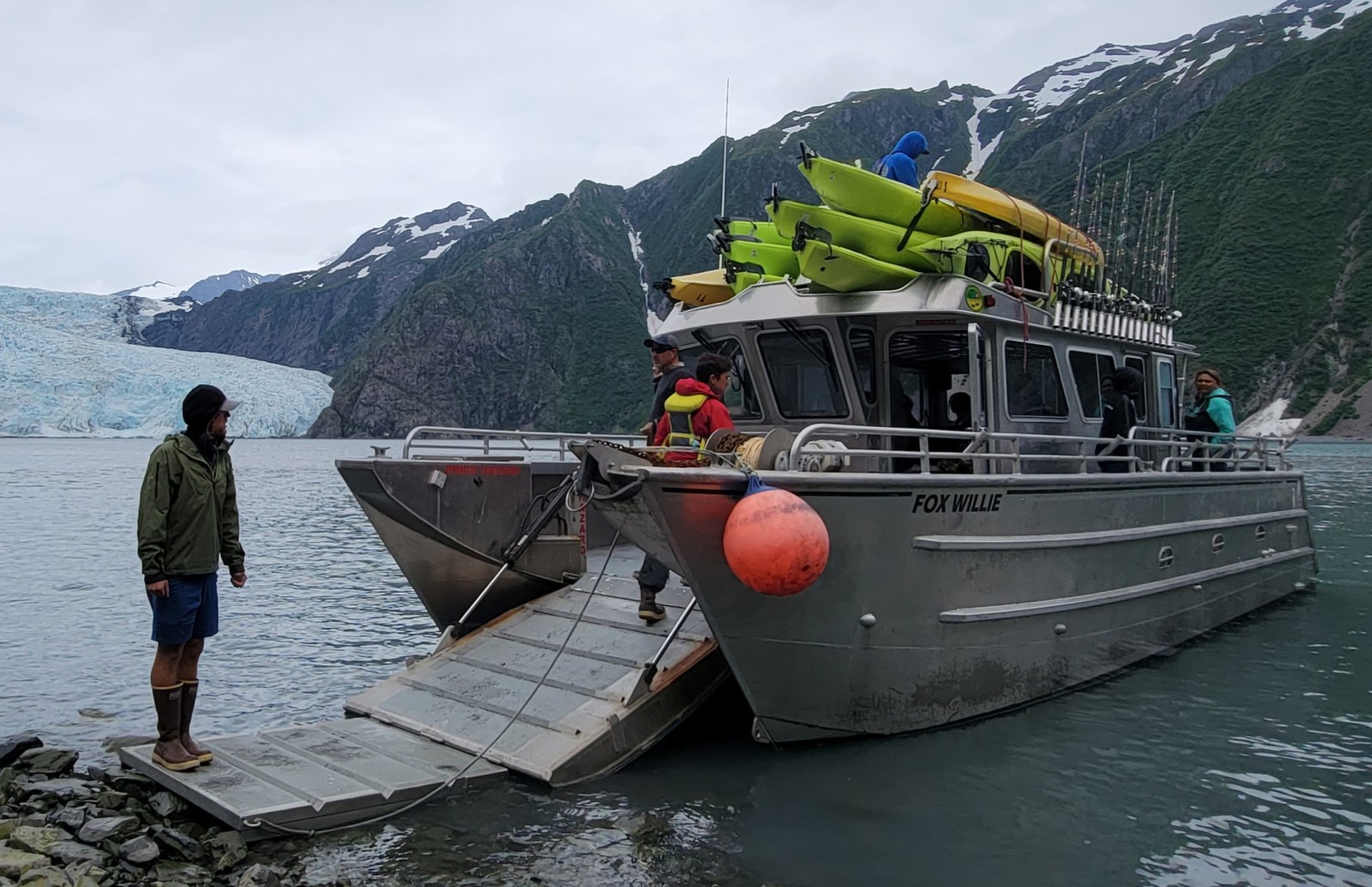 a group of people on a boat in the water