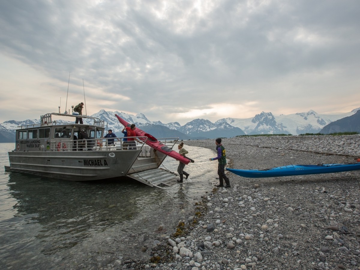a close up of a boat next to a body of water