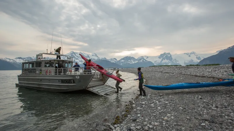 a close up of a boat next to a body of water