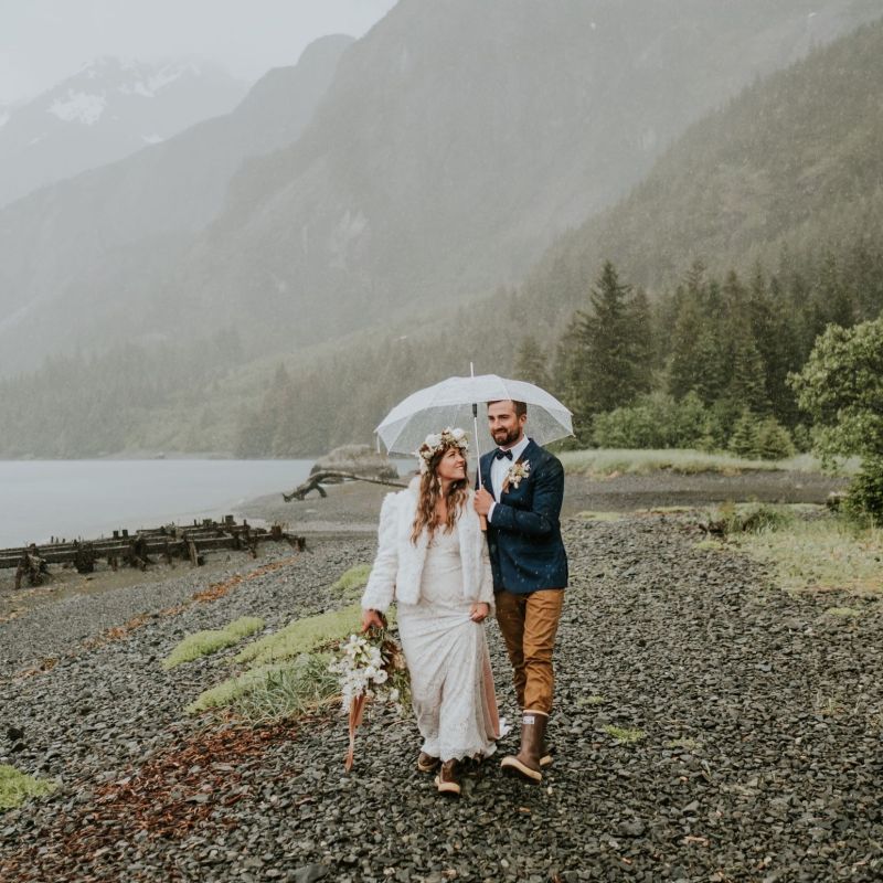 a man standing in front of a mountain