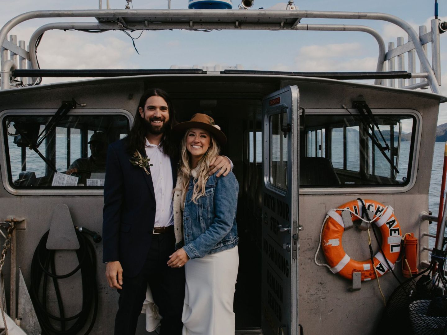 a group of people standing on a boat