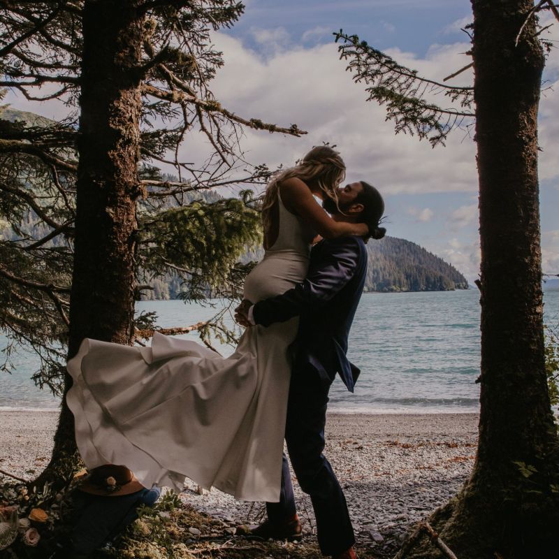 a person standing next to a tree