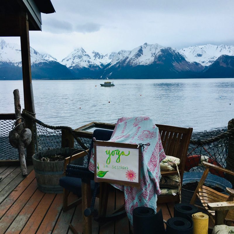 a picnic table next to a body of water