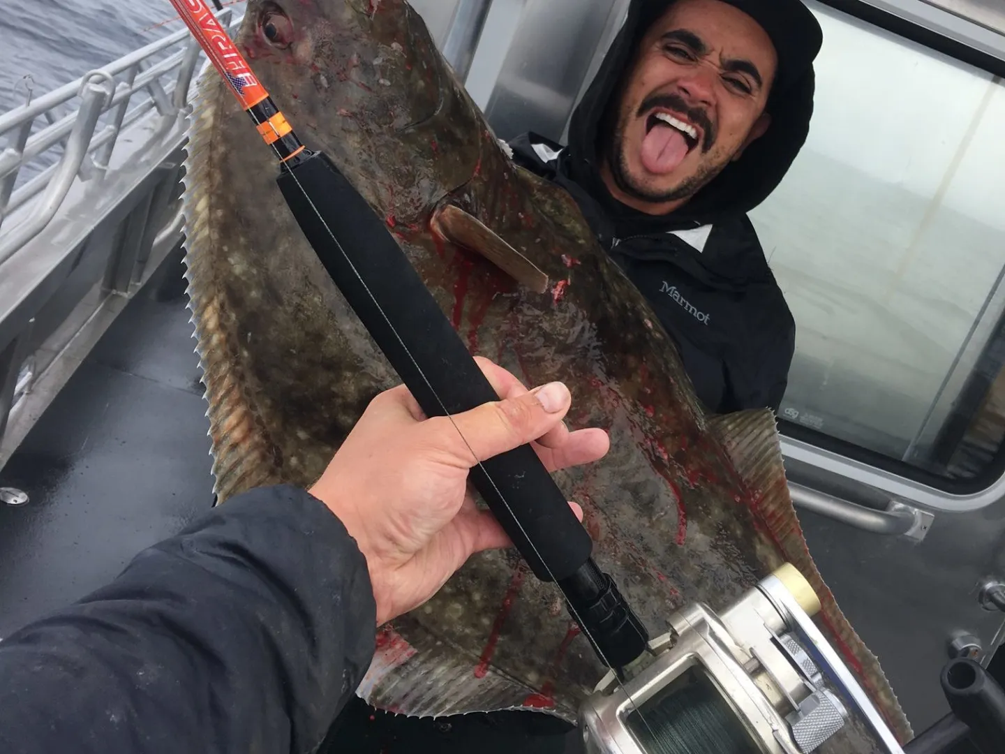 a man holding a fishing pole