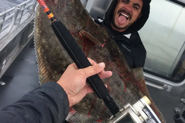 a man holding a fishing pole