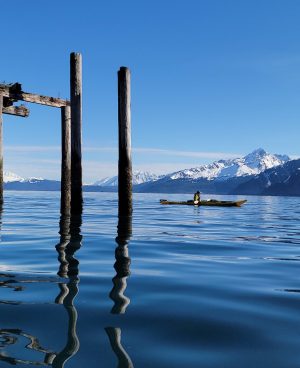 a close up of a pier next to a body of water