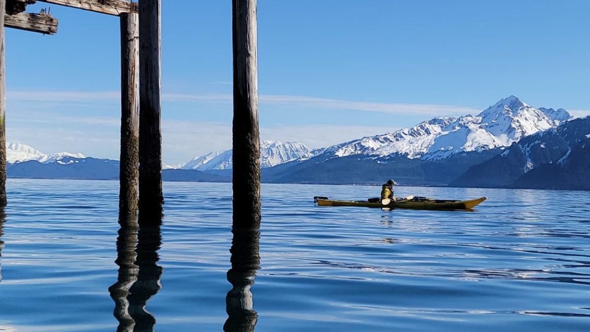 a close up of a pier next to a body of water