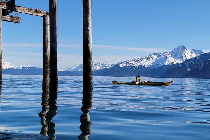 a close up of a pier next to a body of water