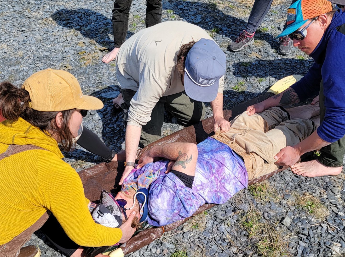 a group of people sitting on the ground
