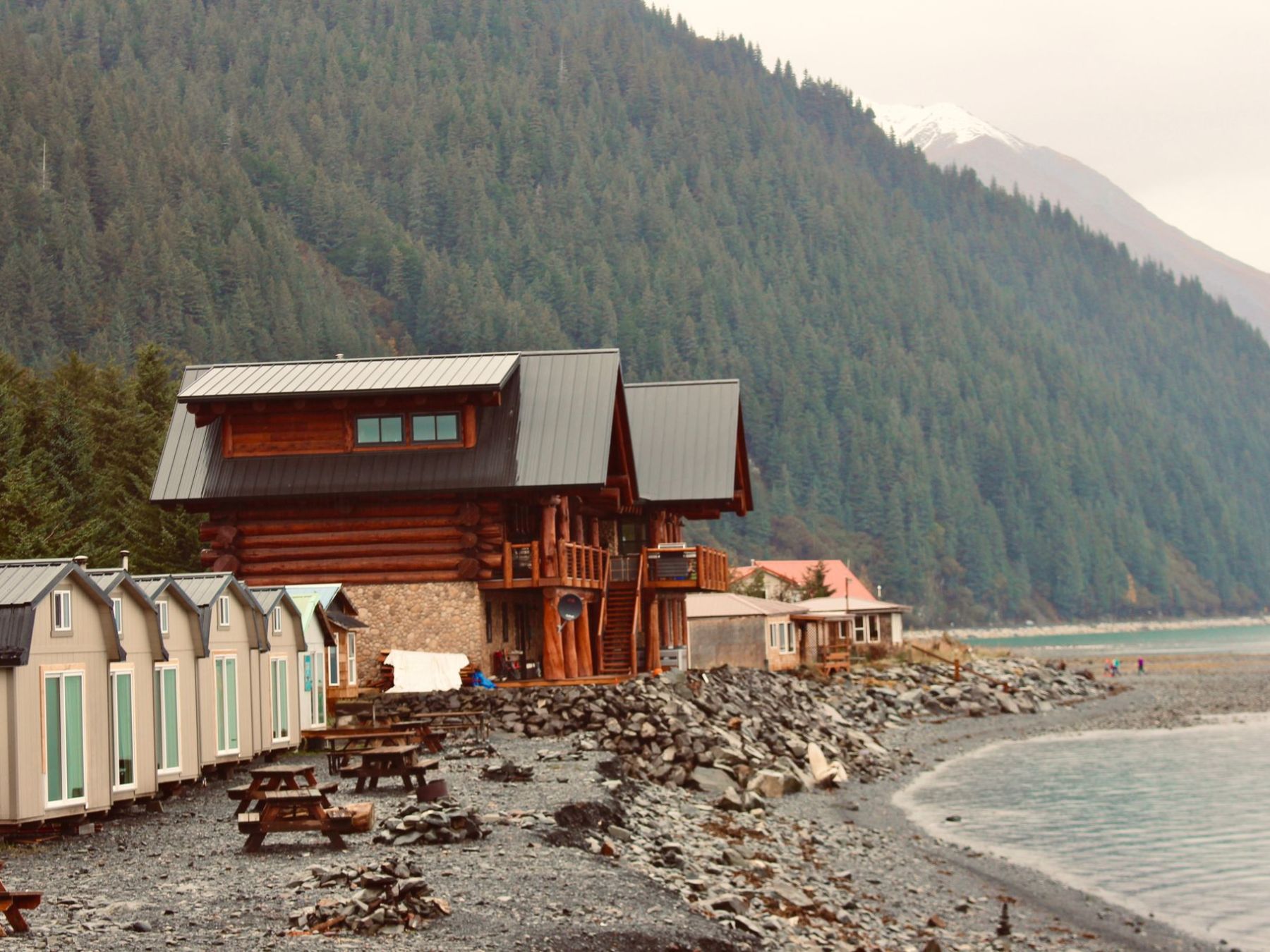a person standing in front of a mountain
