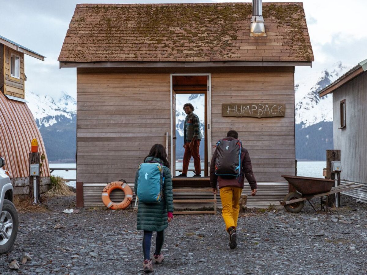 a person standing in front of a house