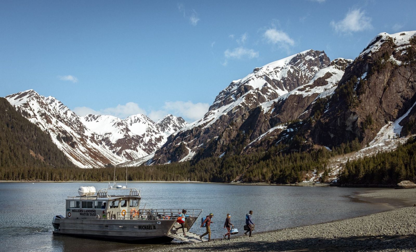 a group of people on a boat in the water