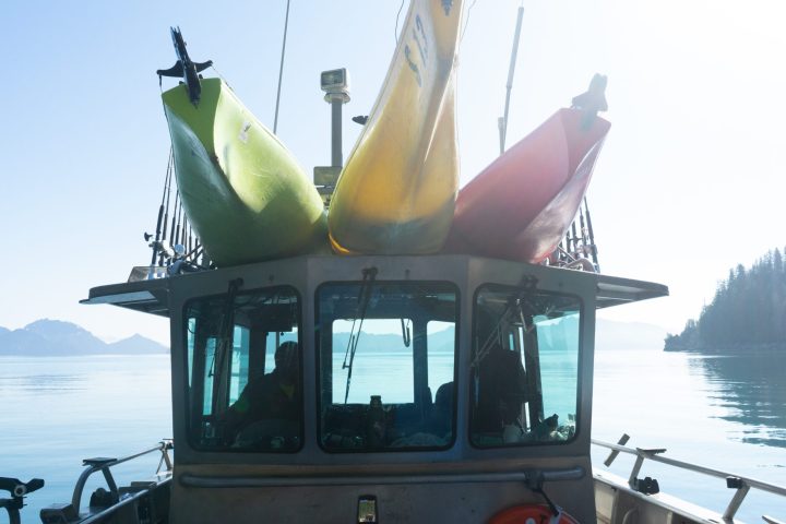 a close up of a boat next to a body of water