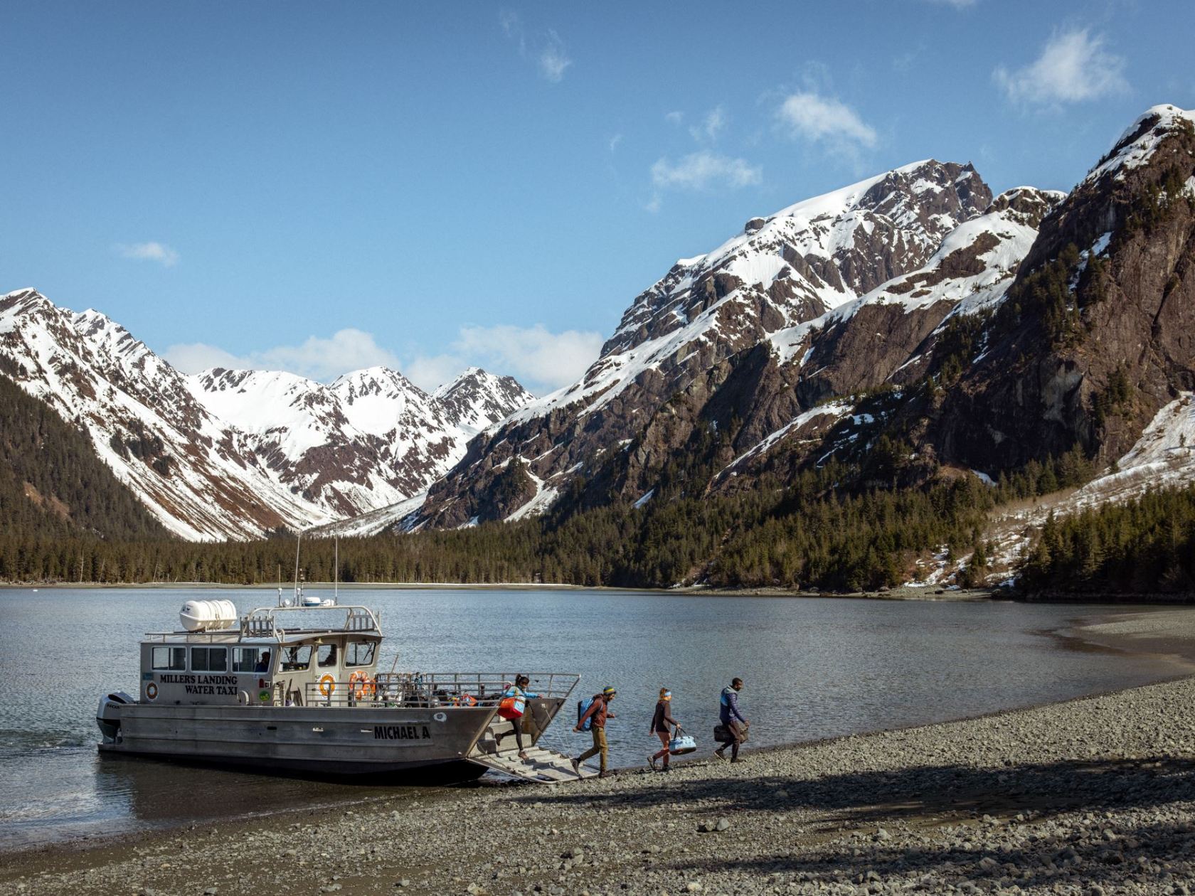 a person standing next to a body of water