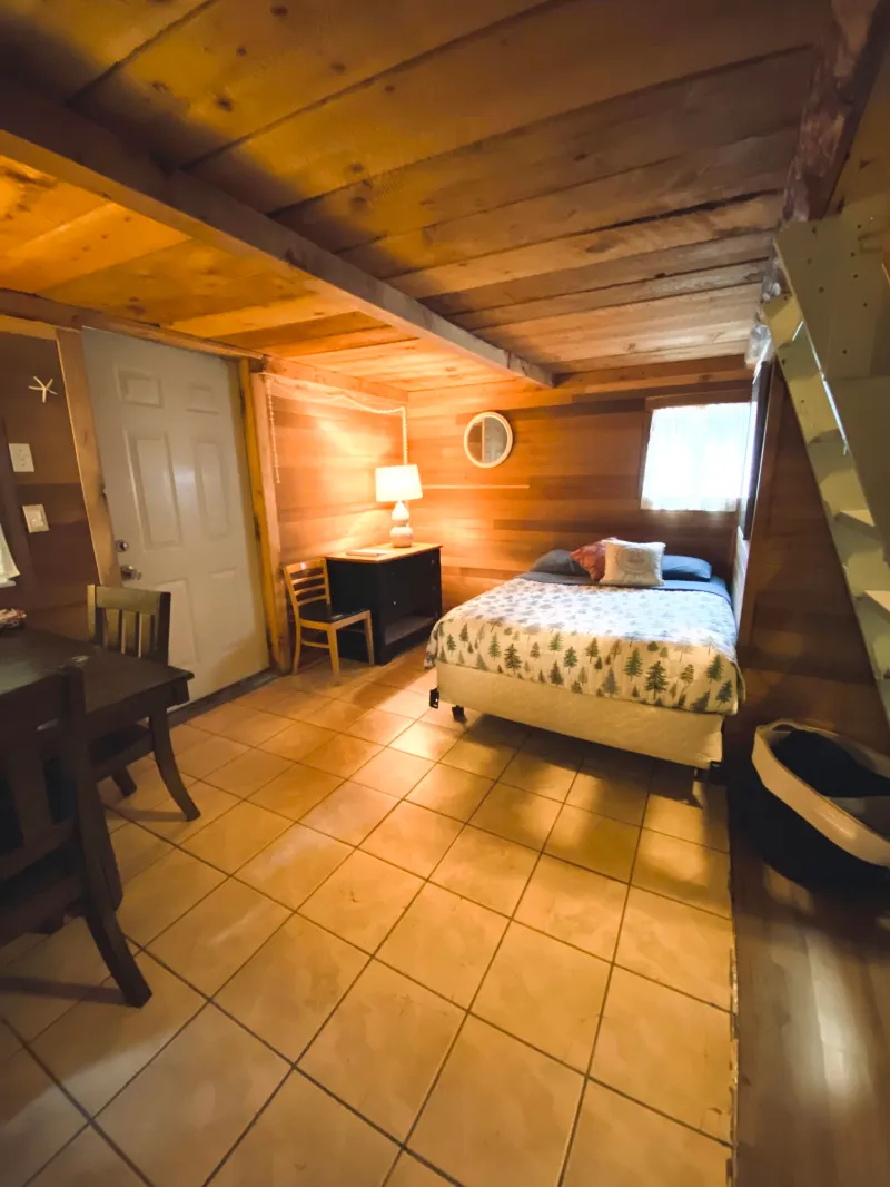 a bedroom with a wooden floor