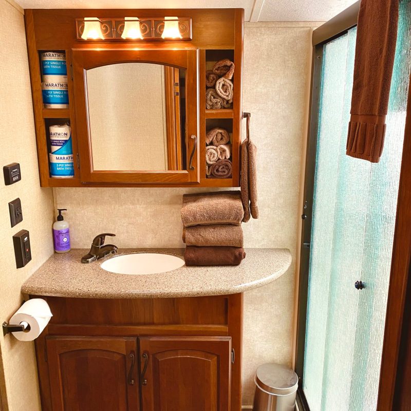 a kitchen with a sink and a mirror