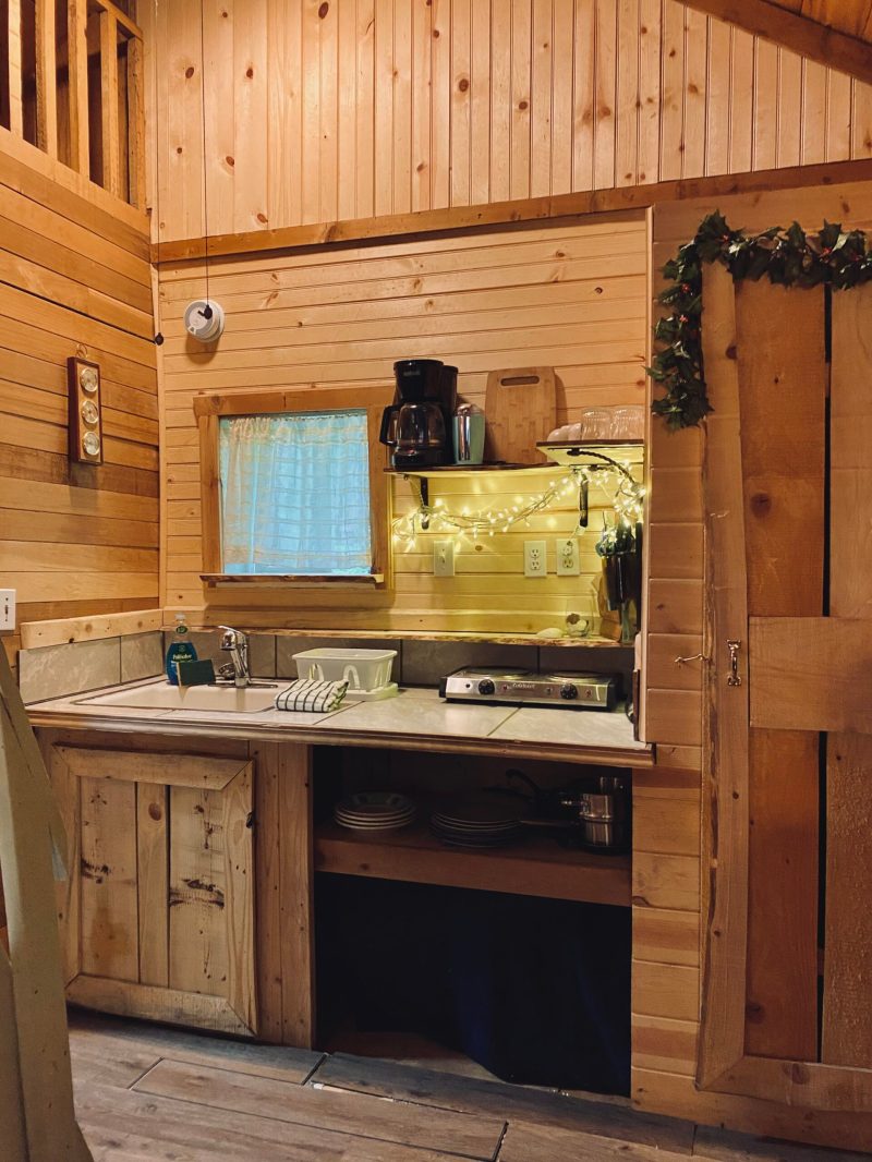 a kitchen with wooden cabinets