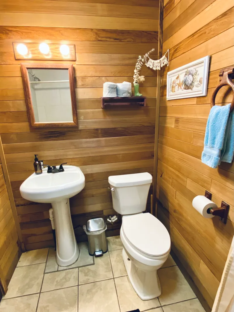 a room with a sink and a mirror