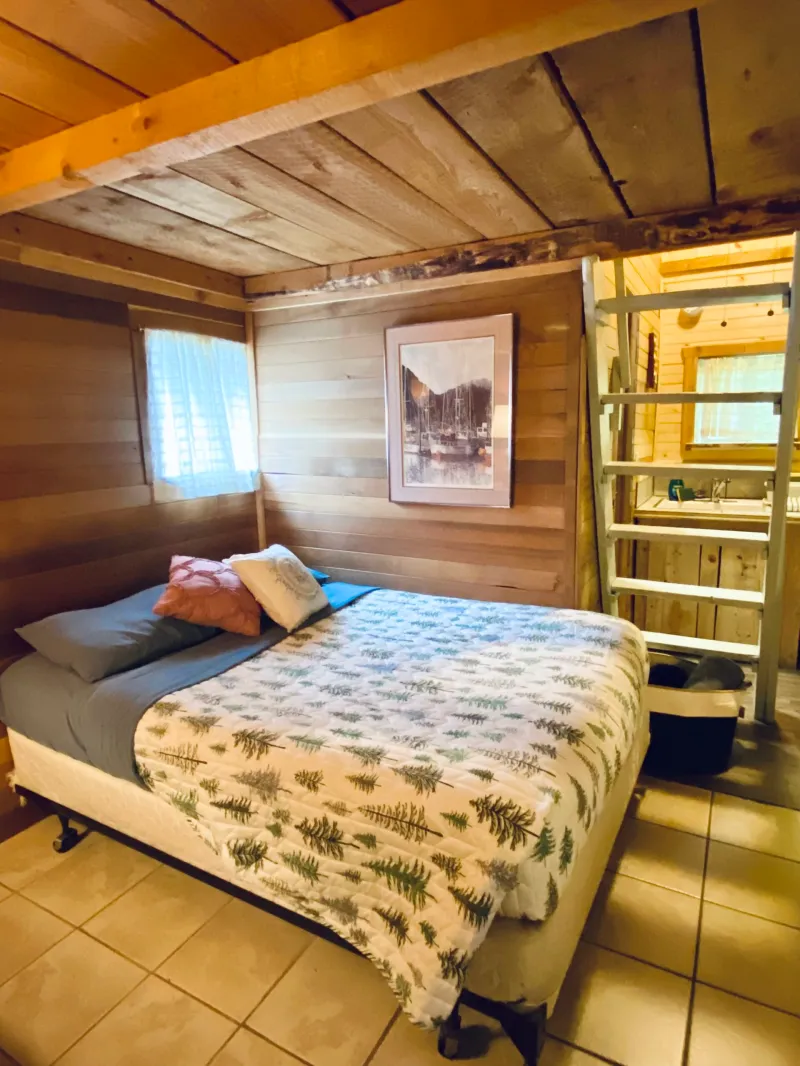 a bedroom with a bed in a room