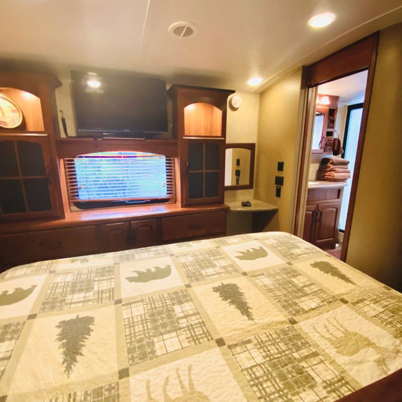 a bedroom with a large bed in a room