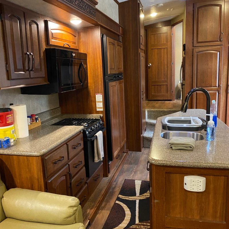 a kitchen with an island in the middle of a room