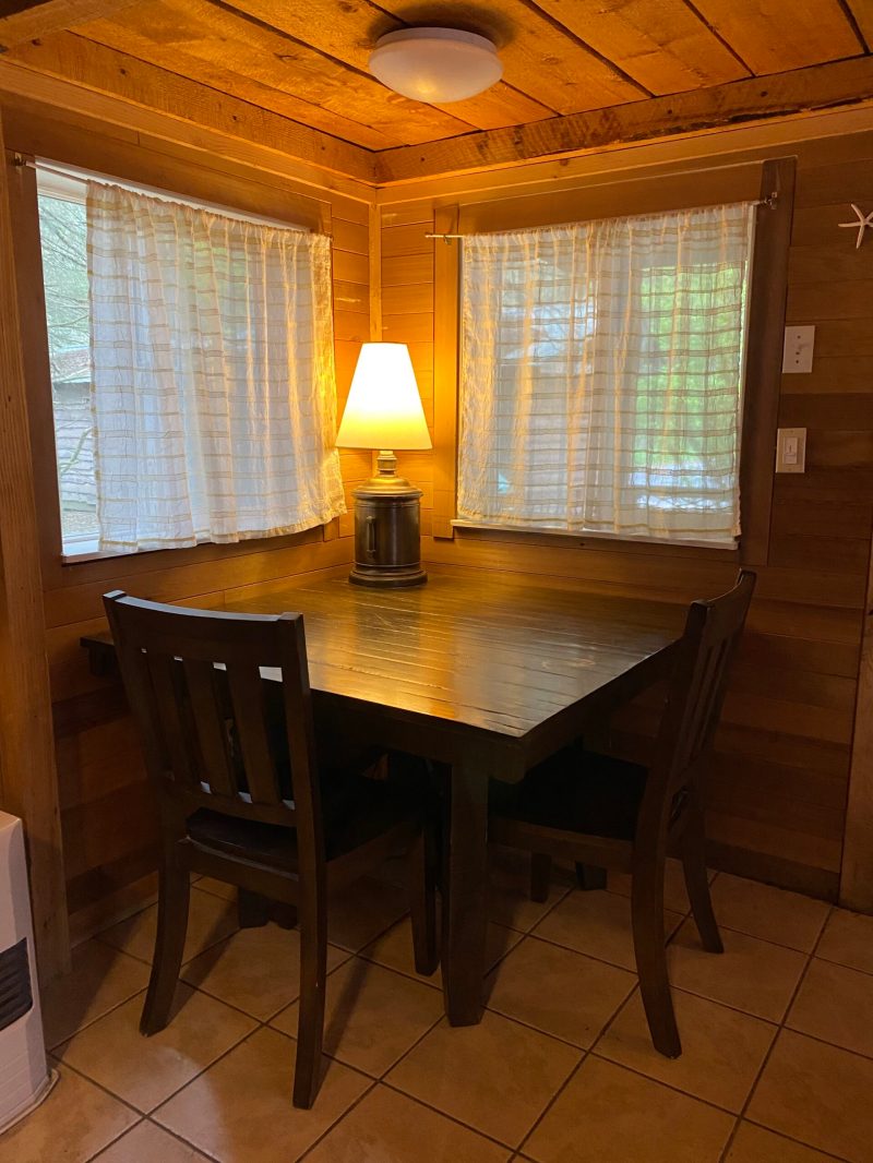 a dining room table in front of a window