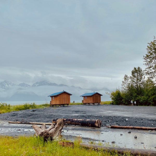 a small house surrounded by water