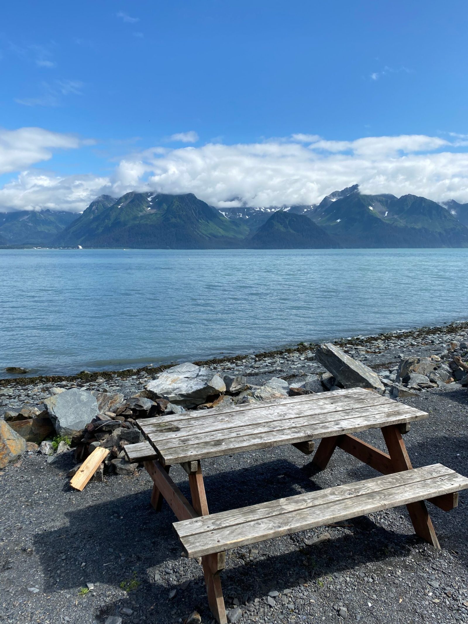 Seaside Beach Seward Alaska Kayaking Fishing Lodging Camping Guided Trips wooden bench sitting next to a body of water