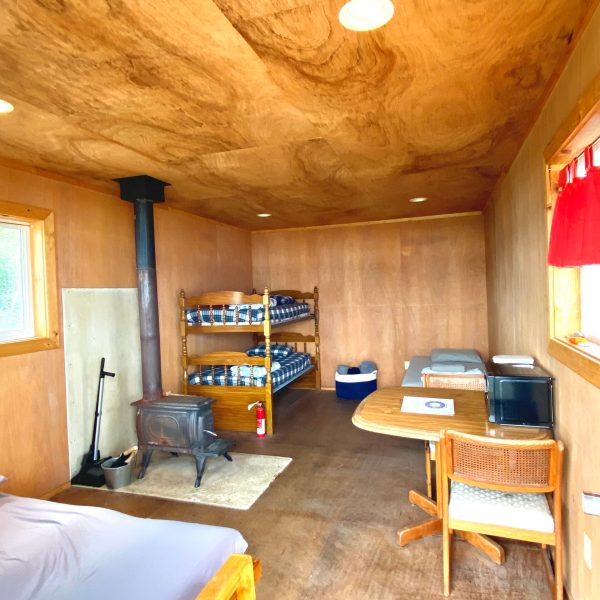 a room filled with furniture on top of a wooden table