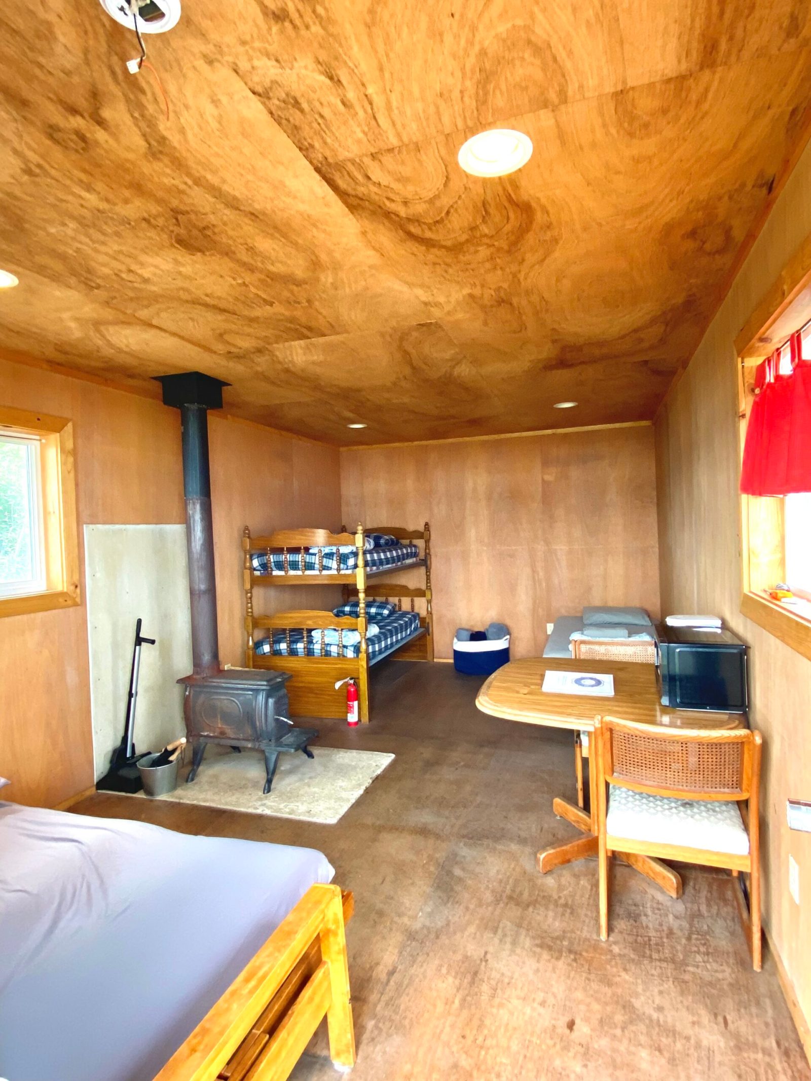 a room filled with furniture on top of a wooden table