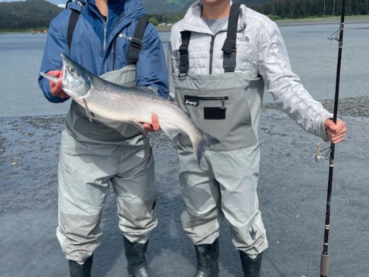 a man holding a fish