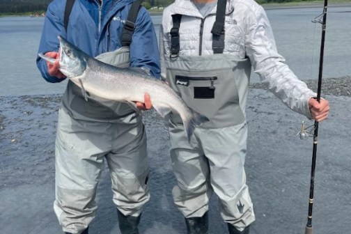 a man holding a fish
