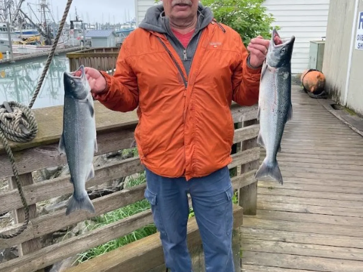 a man holding a fish