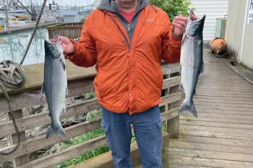 a man holding a fish