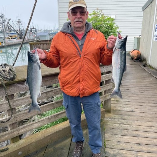 a man holding a fish