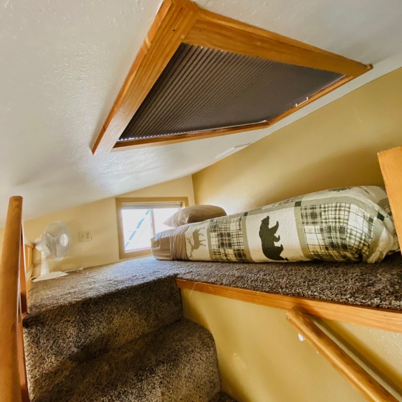 a large bed sitting in a chair