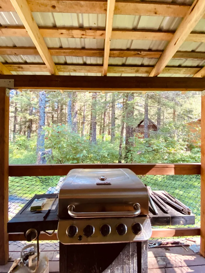 a wooden table next to a window