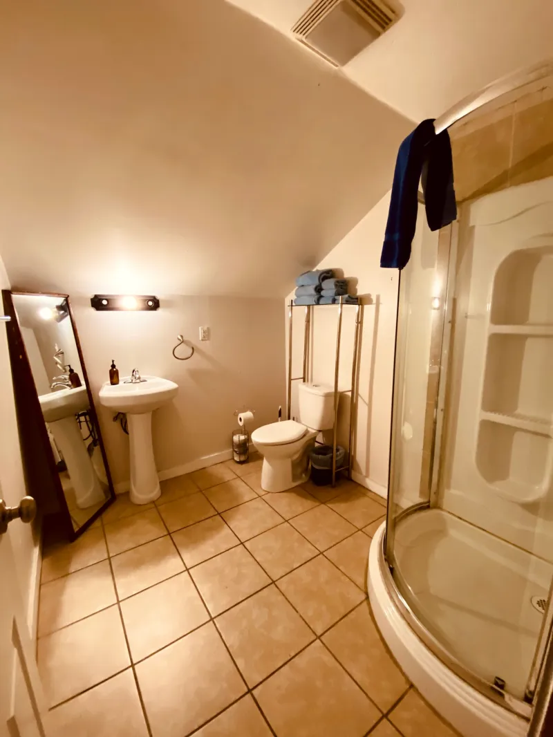 a room with a sink and a mirror