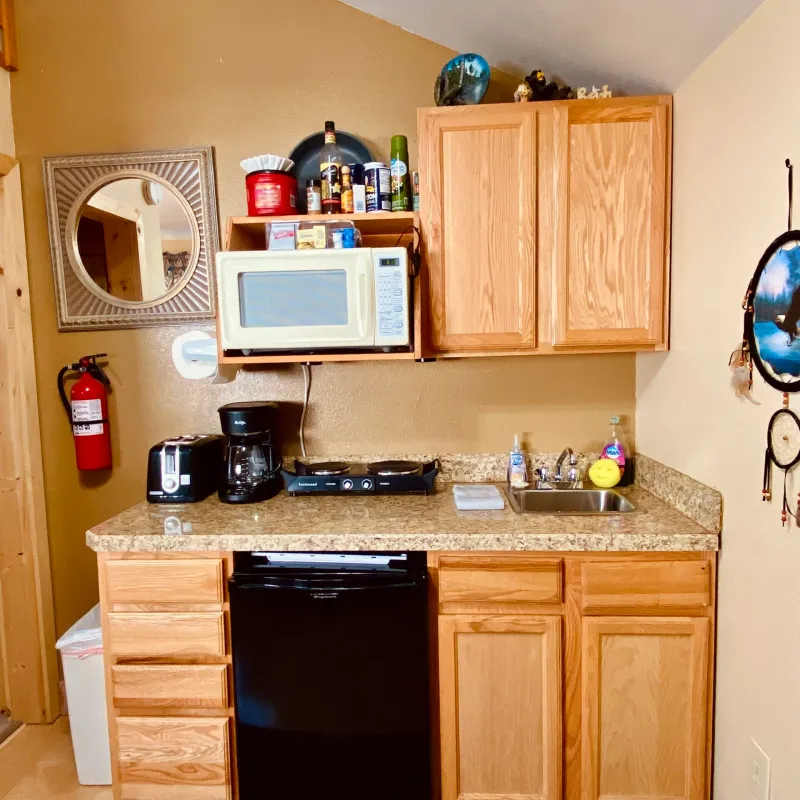 a kitchen with a sink and a microwave