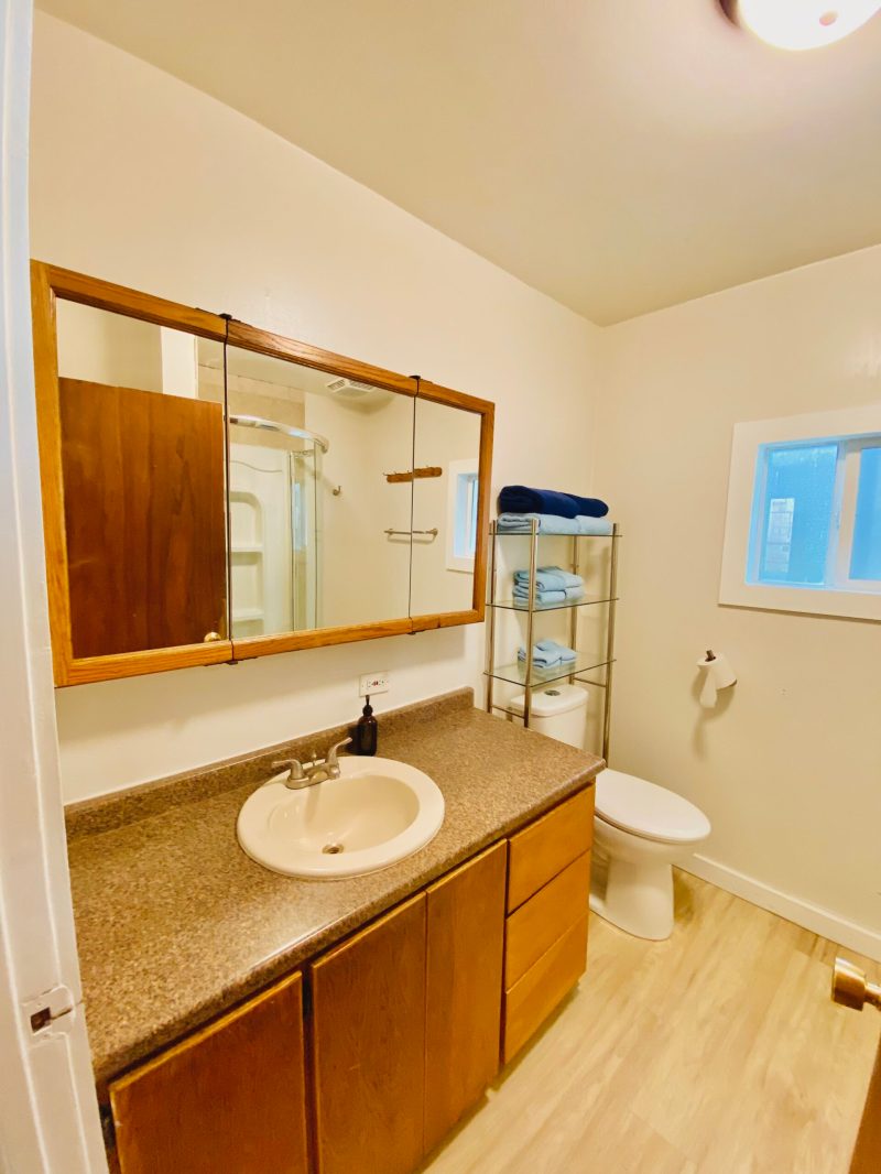 a room with a sink and a mirror