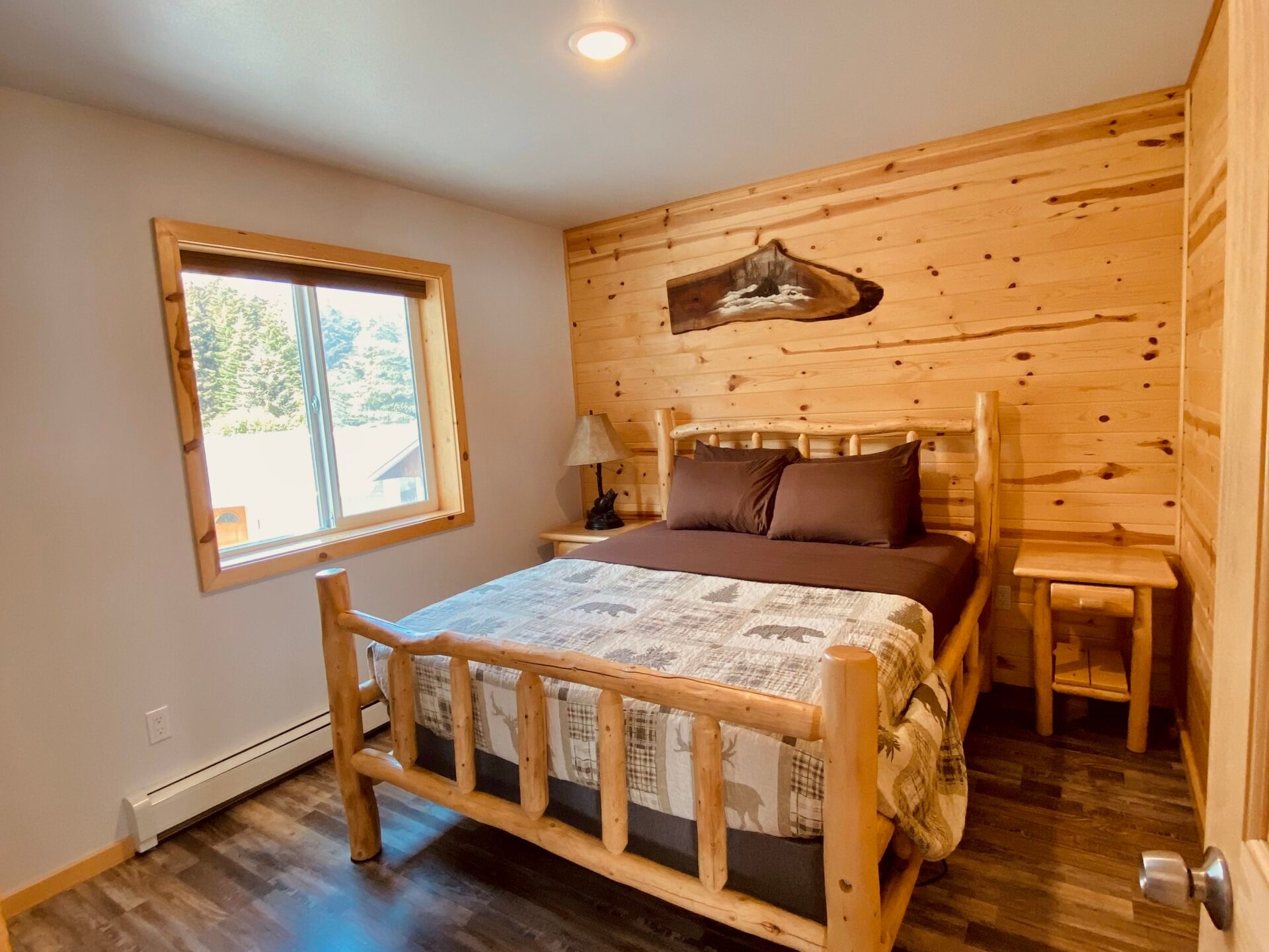 a bedroom with a wooden floor