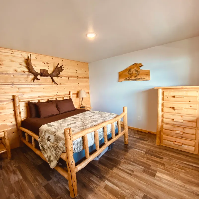 a bedroom with a wooden floor