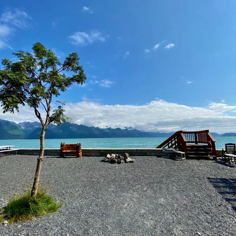 a boat sitting on top of a sandy beach